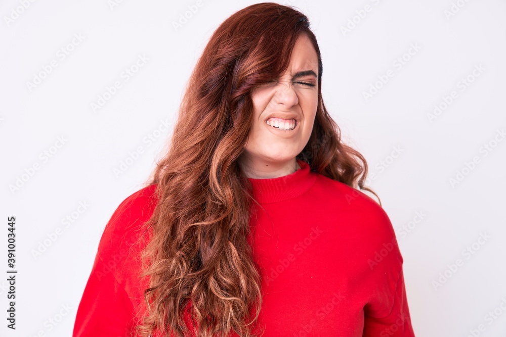 Young beautiful woman wearing casual clothes with hand on stomach because nausea, painful disease feeling unwell. ache concept. Young beautiful woman wearing casual clothes with hand on stomach because nausea, painful disease feeling unwell. ache concept.