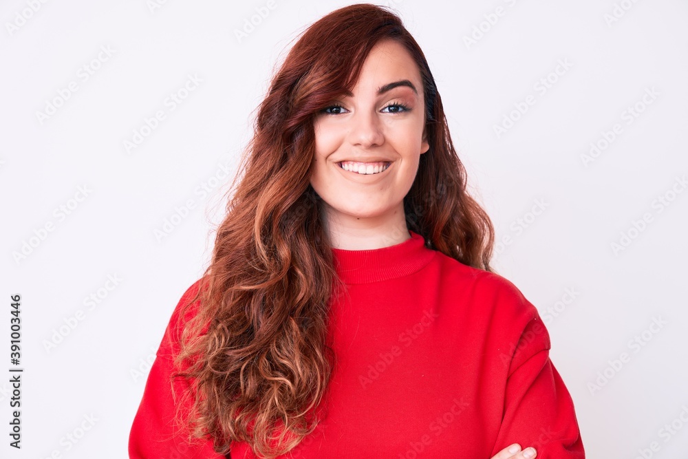 Young beautiful woman wearing casual clothes happy face smiling with crossed arms looking at the camera. positive person. Young beautiful woman wearing casual clothes happy face smiling with crossed arms looking at the camera. positive person.