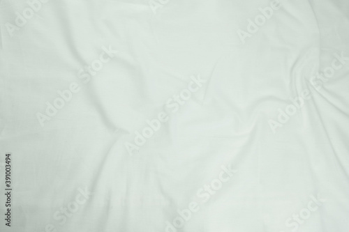 white wrinkled bed sheet  the concept of sexuality  a good photo of the decal or background