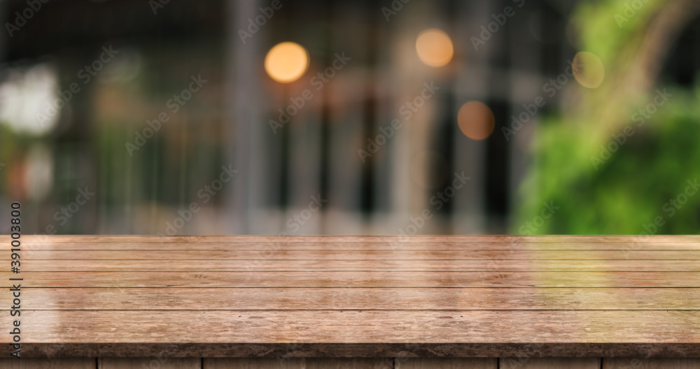 Empty wooden table top with lights bokeh on blur restaurant background. Empty wooden table top with lights bokeh on blur restaurant background.