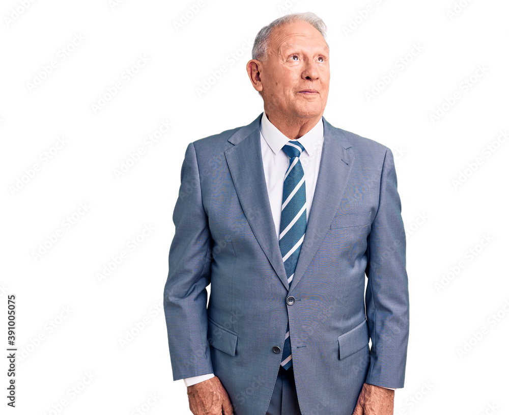 Senior handsome grey-haired man wearing elegant suit smiling looking to the side and staring away thinking. Senior handsome grey-haired man wearing elegant suit smiling looking to the side and staring away thinking.