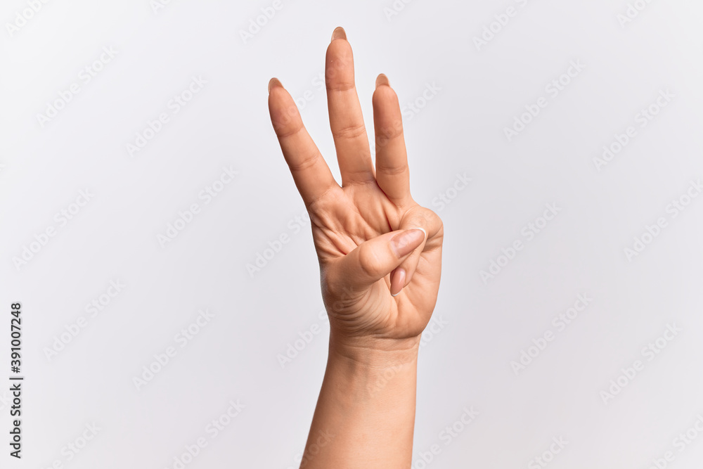 Hand of caucasian young woman counting number 3 showing three fingers Hand of caucasian young woman counting number 3 showing three fingers