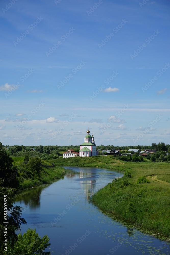 view of the river and the Church of Elijah the Prophet in Suzdal. Russia