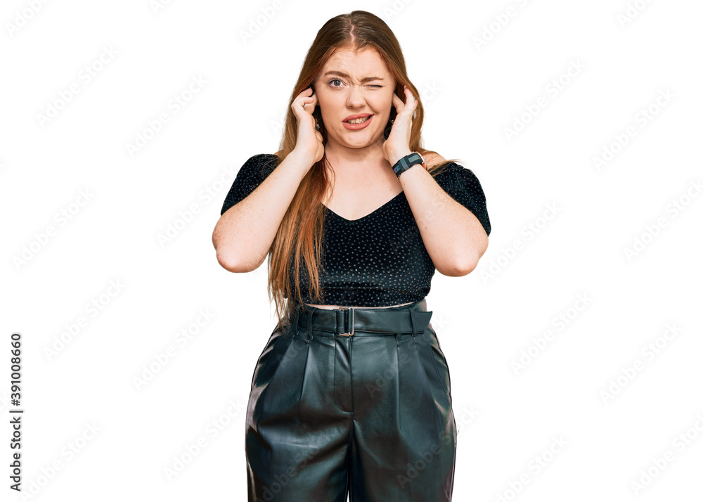 Young beautiful redhead woman wearing elegant clothes covering ears with fingers with annoyed expression for the noise of loud music. deaf concept.