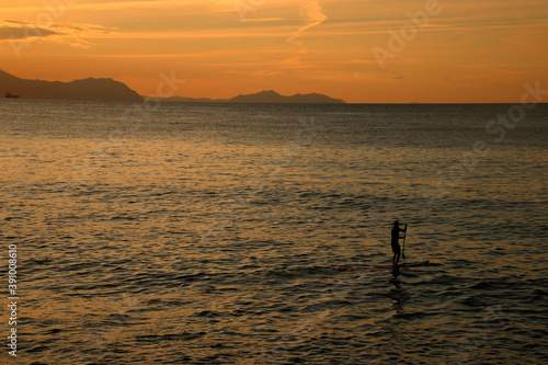 Paddle boarding in the evening