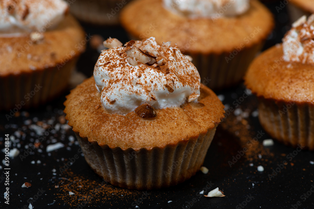 portioned mini cakes with whipped cream, closeup