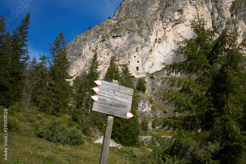 Signs used in trekking to indicate the routes in the dolomites at wolkenstein castle in the rocks photo