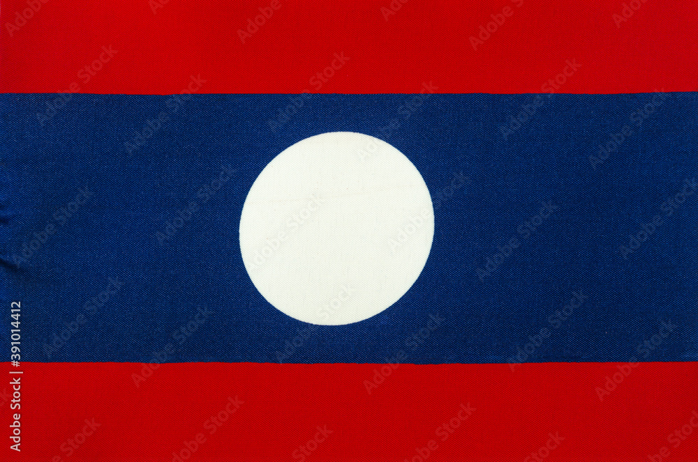 fabric of the national flag of the Lao people's Democratic Republic close-up fabric of the national flag of the Lao people's Democratic Republic close-up