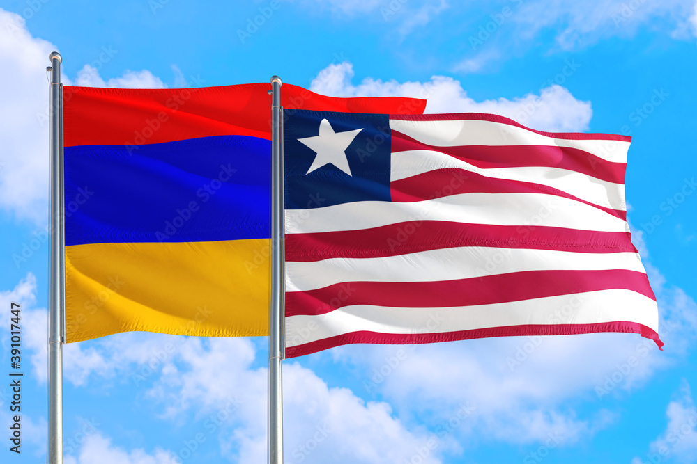 Liberia and Armenia national flag waving in the windy deep blue sky. Diplomacy and international relations concept. Liberia and Armenia national flag waving in the windy deep blue sky. Diplomacy and international relations concept.