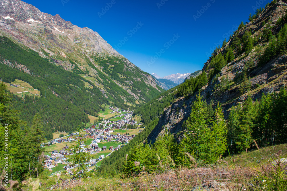 Alpine resort village Saas-Grund lies in Saas valley at 1559m east of Lenzspitze and Dom. Surrounded by snow-covered mountains, green meadows and forests it is a popular travel destination in summer