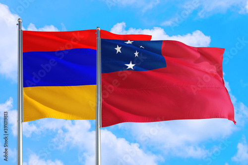 Samoa and Armenia national flag waving in the windy deep blue sky. Diplomacy and international relations concept.