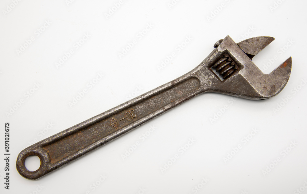 Old rusty Adjustable Wrench on white background. Old rusty Adjustable Wrench on white background.