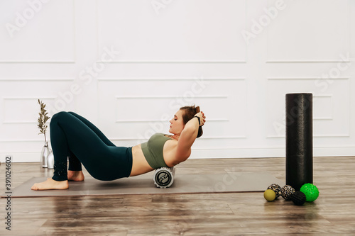 Konstfotografi Adult sporty woman doing fascia exercise on the floor