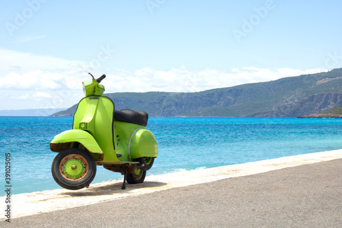 Old vintage scooter at the beach sea