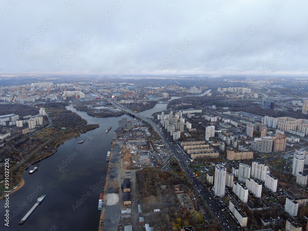 Aerial view panoramic cityscape with great height. River in a big city from a drone