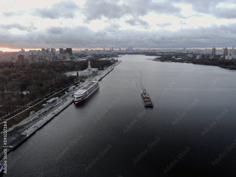 Aerial view panoramic cityscape river port with ships in the center of the big city at dawn. North River Station. Moscow. Russia Aerial view panoramic cityscape river port with ships in the center of the big city at dawn. North River Station. Moscow. Russia