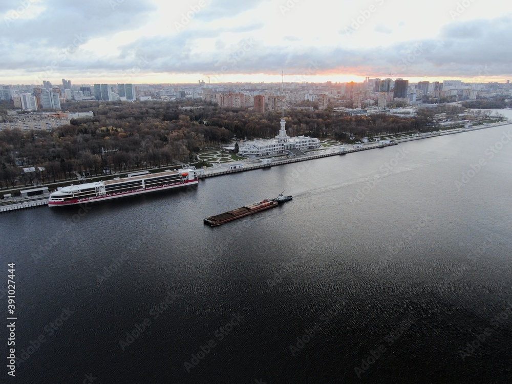Aerial view panoramic cityscape river port with ships in the center of the big city at dawn. North River Station. Moscow. Russia