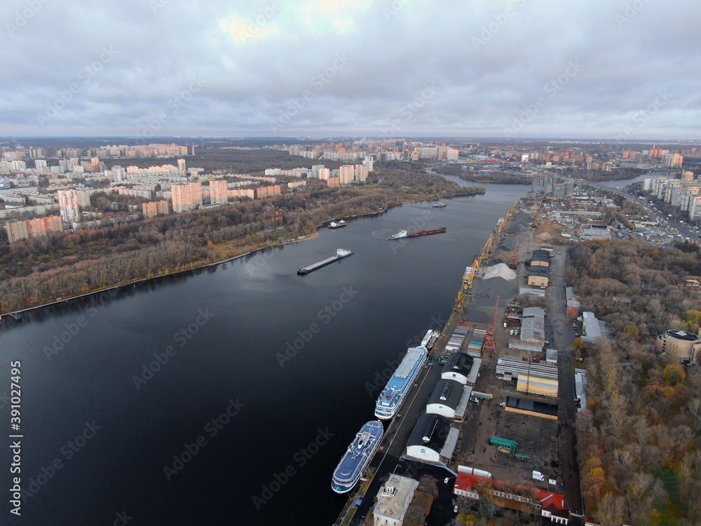 Obraz premium Aerial view panoramic cityscape with great height. River in a big city from a drone