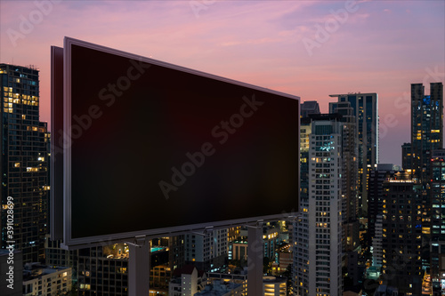 Blank black road billboard with Bangkok cityscape background at night time. Street advertising poster  mock up  3D rendering. Side view. The concept of marketing communication to promote idea.