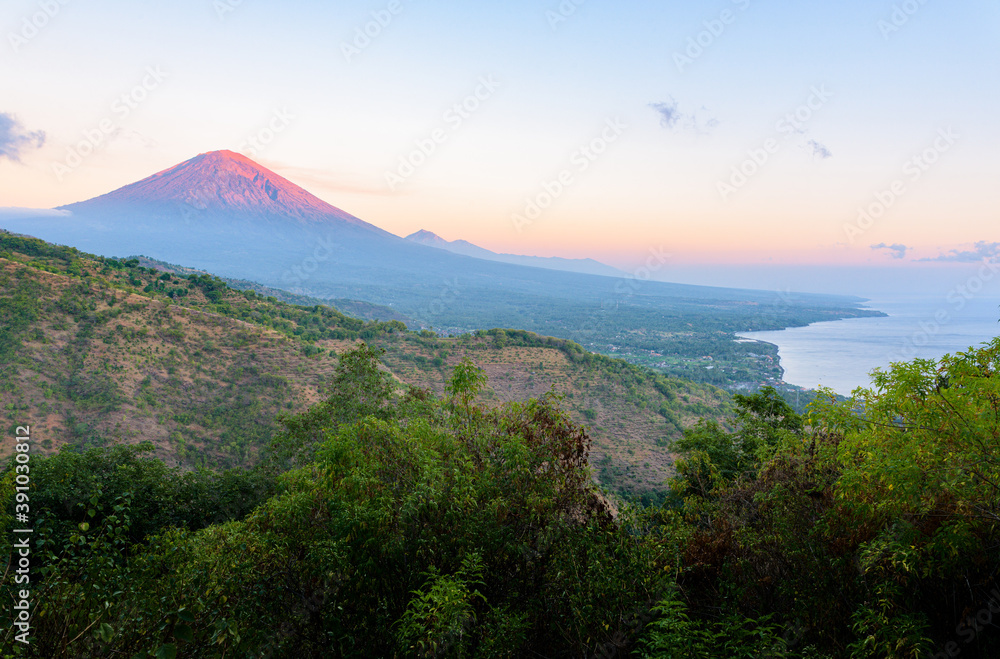 Φωτογραφία Landscape of Bali north coastline at sunrise, with Mount Agung volcano peak and