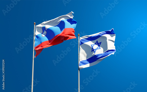 Beautiful national state flags of Slovenia and Israel together at the sky background. 3D artwork concept.
