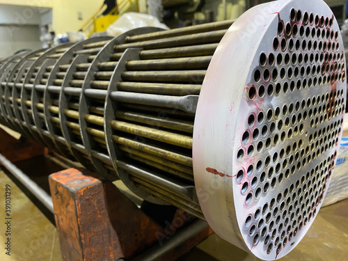 Penetrant testing at shell and tube heat exchanger with white and red spray painting for recheck crack point, Penetrant inspection photo