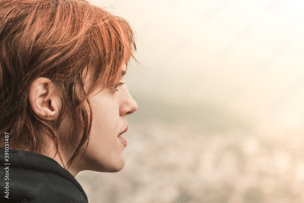 Portrait of a beautiful happy girl with red hair in the cave, lifestyle Portrait of a beautiful happy girl with red hair in the cave, lifestyle