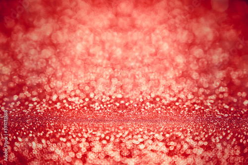 Christmas red bokeh background. Defocused abstract red background. Red glitter bokeh.