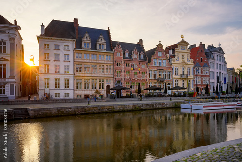 View of Korenlei quay and Leie river in the historic city center in Ghent (Gent), Belgium. Architecture and landmark of Ghent. Sunset cityscape of Ghent. © Ekaterina Belova