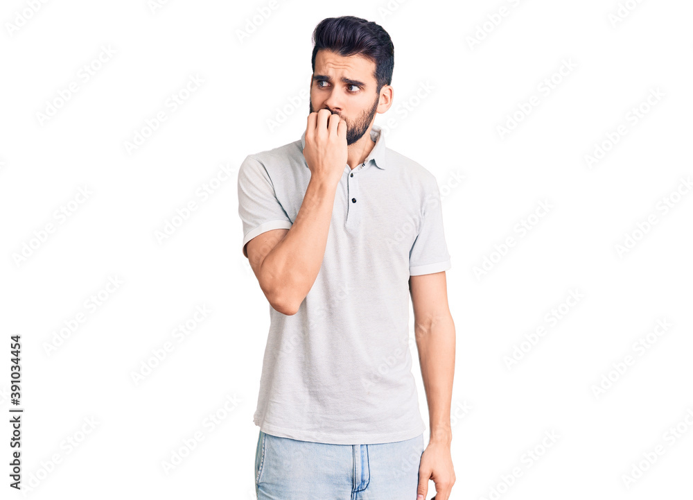 Young handsome man with beard wearing casual polo looking stressed and nervous with hands on mouth biting nails. anxiety problem. Young handsome man with beard wearing casual polo looking stressed and nervous with hands on mouth biting nails. anxiety problem.
