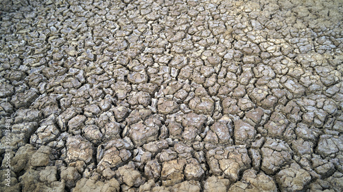 Global warming issue Cracked earth and Dry water is soft focus, Full Frame Shot of Cracked Land, Soil Texture, Faded, Weak Reds