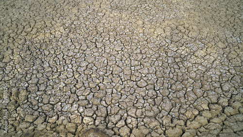 Close up view of cracked dried soil. Desiccation in soil, hard panic surface, natural dryness and rough desert plains. It occurs naturally Laterite soil.