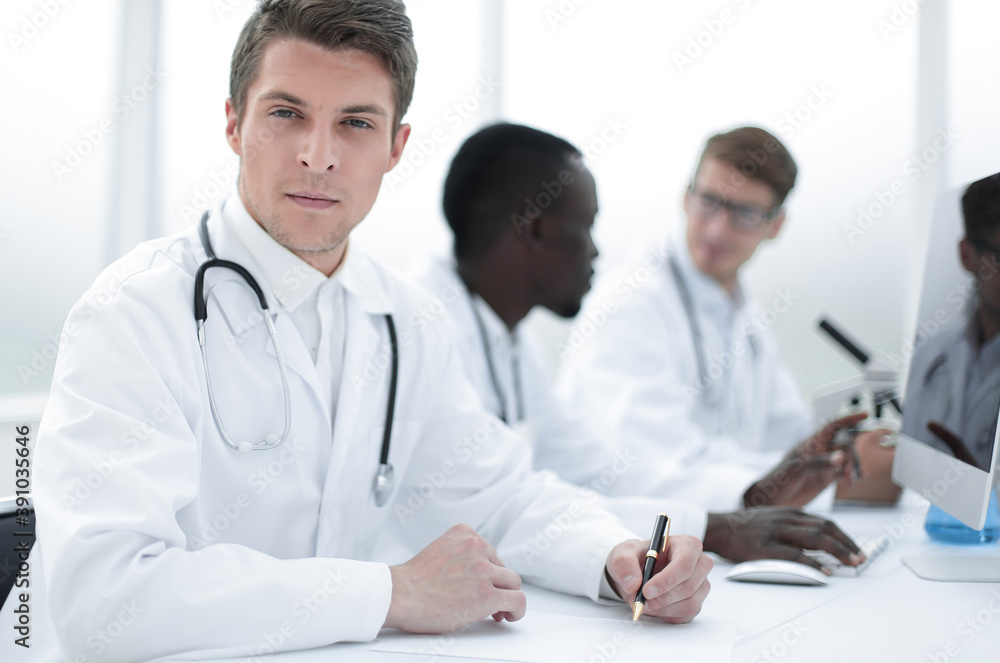 doctor writing down the data in the laboratory journal doctor writing down the data in the laboratory journal