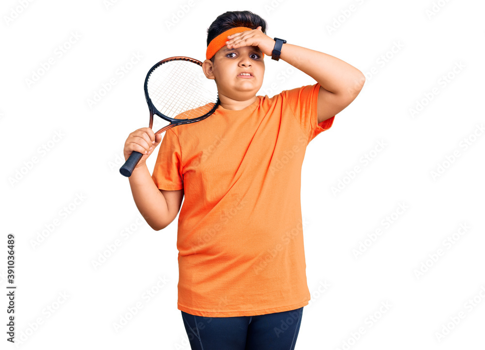Little boy kid playing tennis holding racket stressed and frustrated with hand on head, surprised and angry face Little boy kid playing tennis holding racket stressed and frustrated with hand on head, surprised and angry face