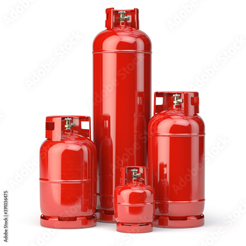 Different types of red gas bottles isolated on white background.