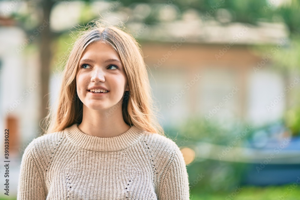 Beautiful caucasian teenager smiling happy standing at the city. Beautiful caucasian teenager smiling happy standing at the city.