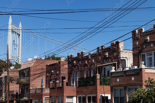Row of Old Brick Homes with the Triborough Bridge in Astoria Queens New York