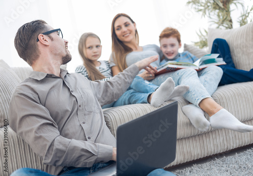 happy family spends their free time in their living room.