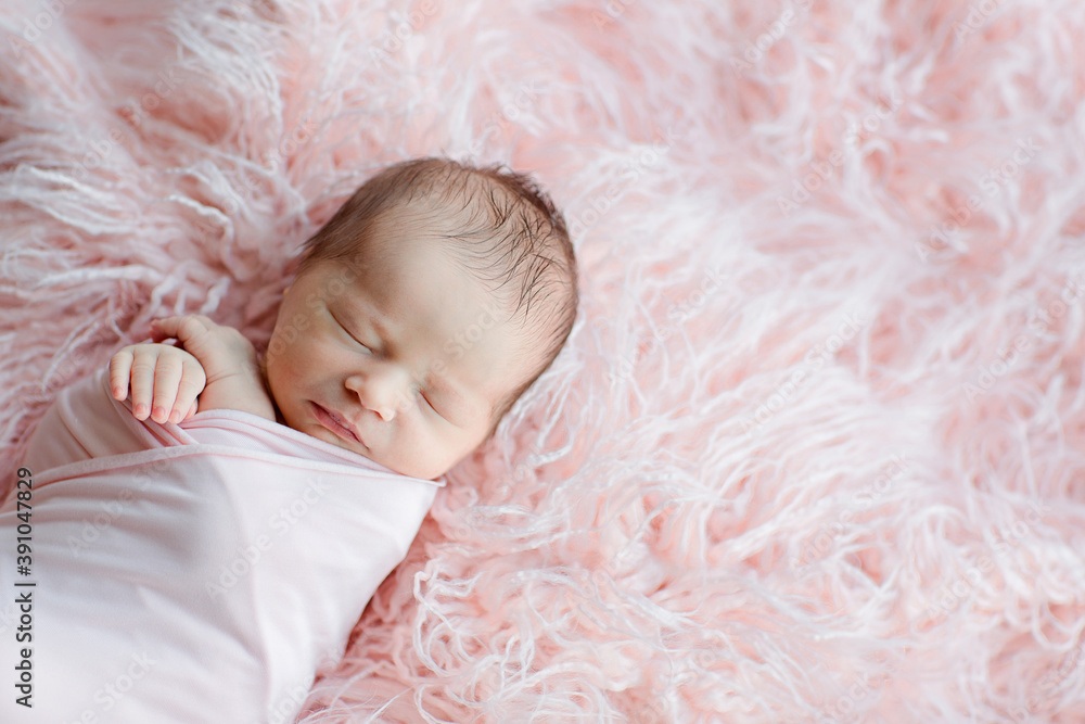 Cute newborn baby sleeping on pink blanket. Baby goods packaging template. Healthy and medical concept. Copy space Cute newborn baby sleeping on pink blanket. Baby goods packaging template. Healthy and medical concept. Copy space