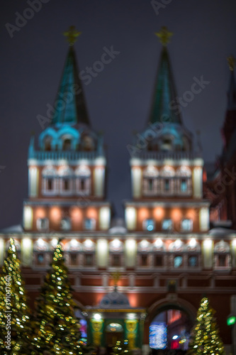 Russia, Moscow New Year. Defocused abstract image of the Kremlin towers and Christmas trees.