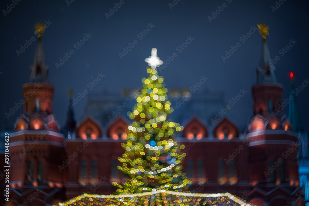 Christmas tree on the background of the Kremlin towers in Moscow, abstract image blurred as a background