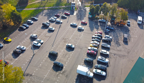 Top view of a parking lot with cars