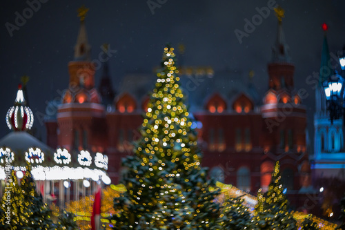 Christmas tree on the background of the Kremlin towers in Moscow, abstract image blurred as a background