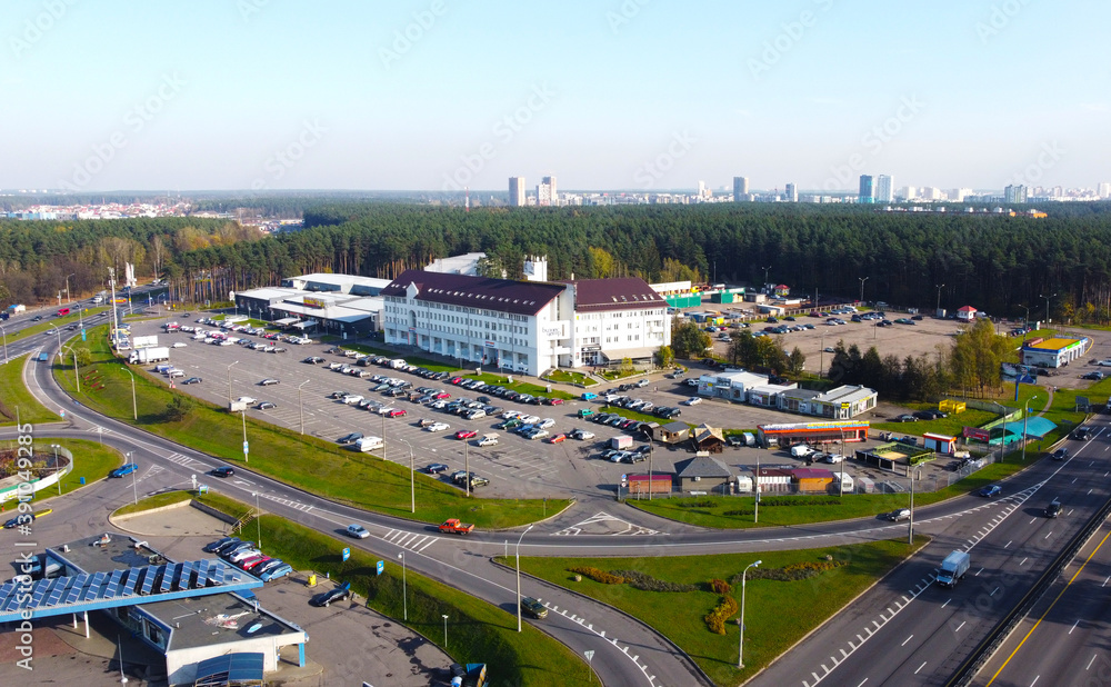 Fototapeta premium Top view of a business center with parking near the road