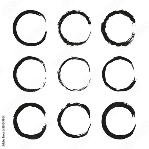 Set of hand drawn black grunge painted round frames isolated on white background.