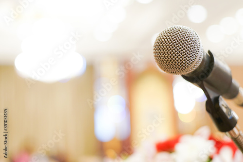 Microphone close up in meeting seminar room blurred background with bokeh