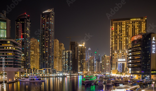 Dubai Marina at night, with all the lights from buildings and the boats making for a beautiful scene