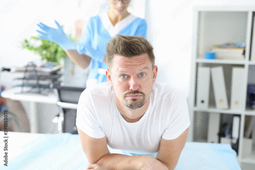Obraz premium Man in medical office at proctologist. Helping patients with bowel problems concept