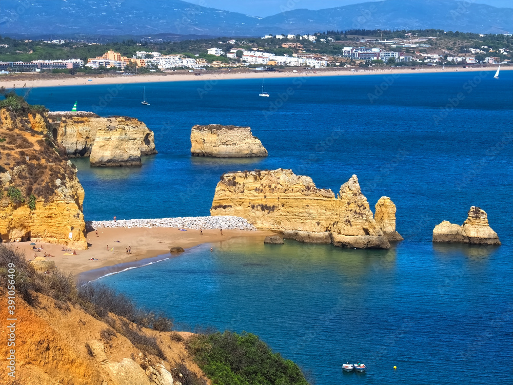 The beauty of Portugal - hiking in Lagos at the blue Atlantic ocean in Portugal