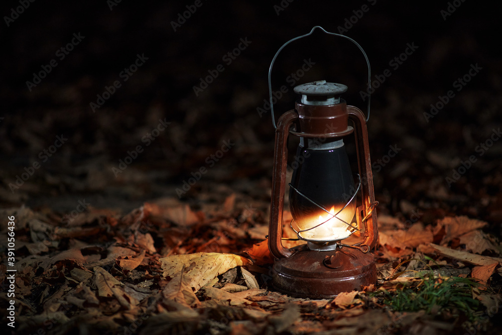 Night study and travel with burning kerosene lamp. Burning lamp education concept, horizontal photoshop overlay, design element for website and social media